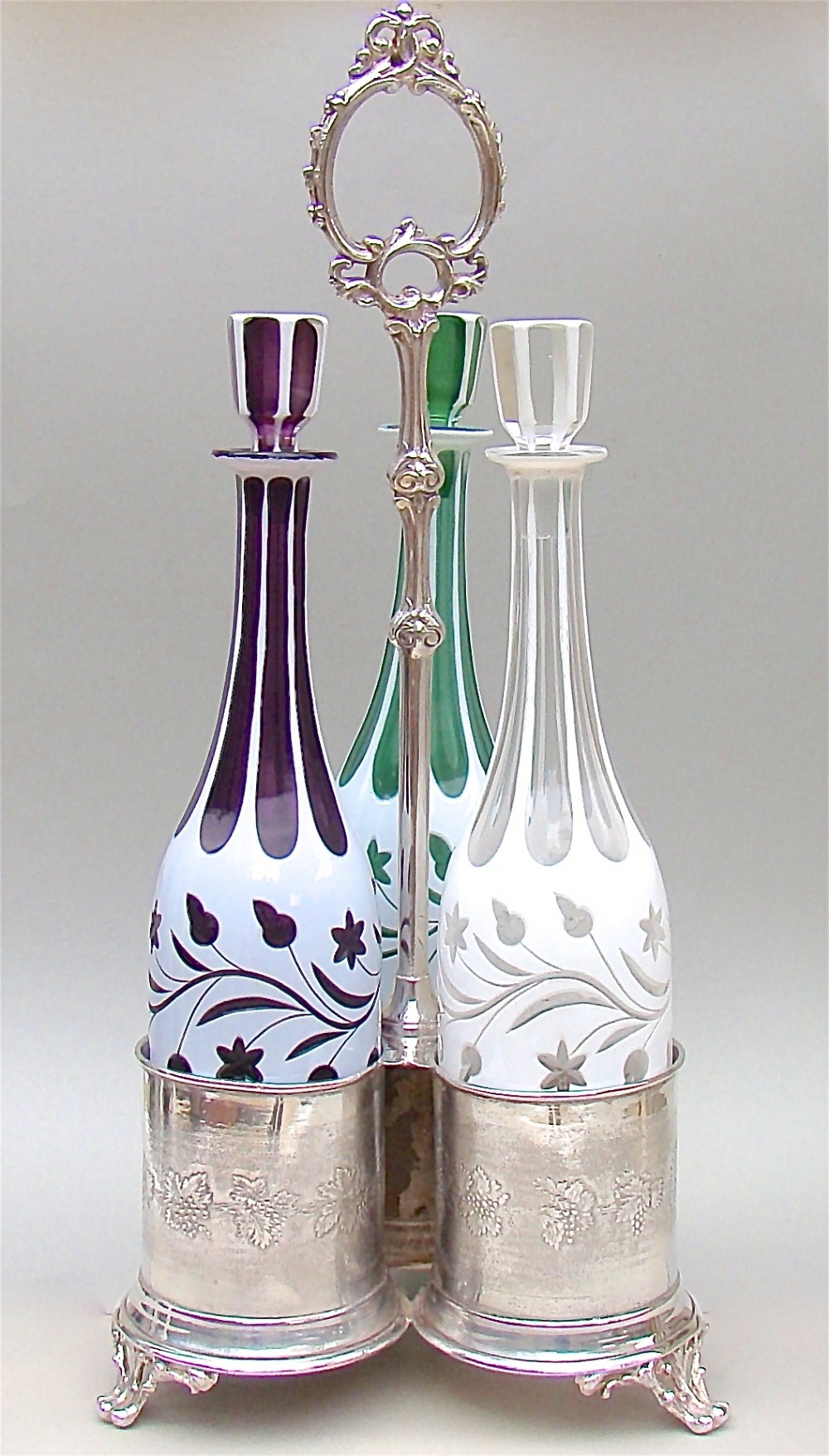 set of three 19th c bohemian glass decanters with silver plated stand circa 1890
