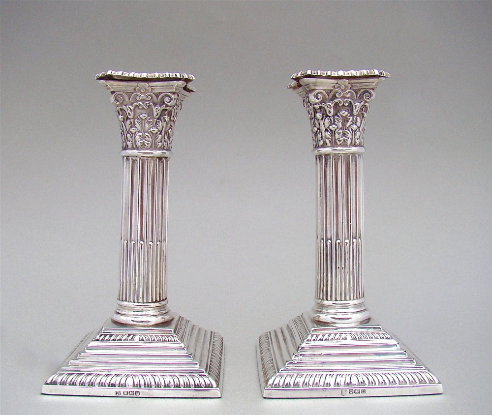 pair of george v sterling silver corinthian column candlesticks by thomas bradbury sons sheffield 1915