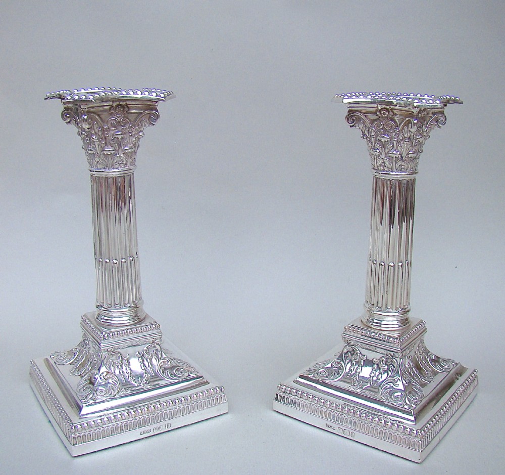 fabulous pair of edwardian silver corinthian column candlesticks by james dixon sons sheffield 1901