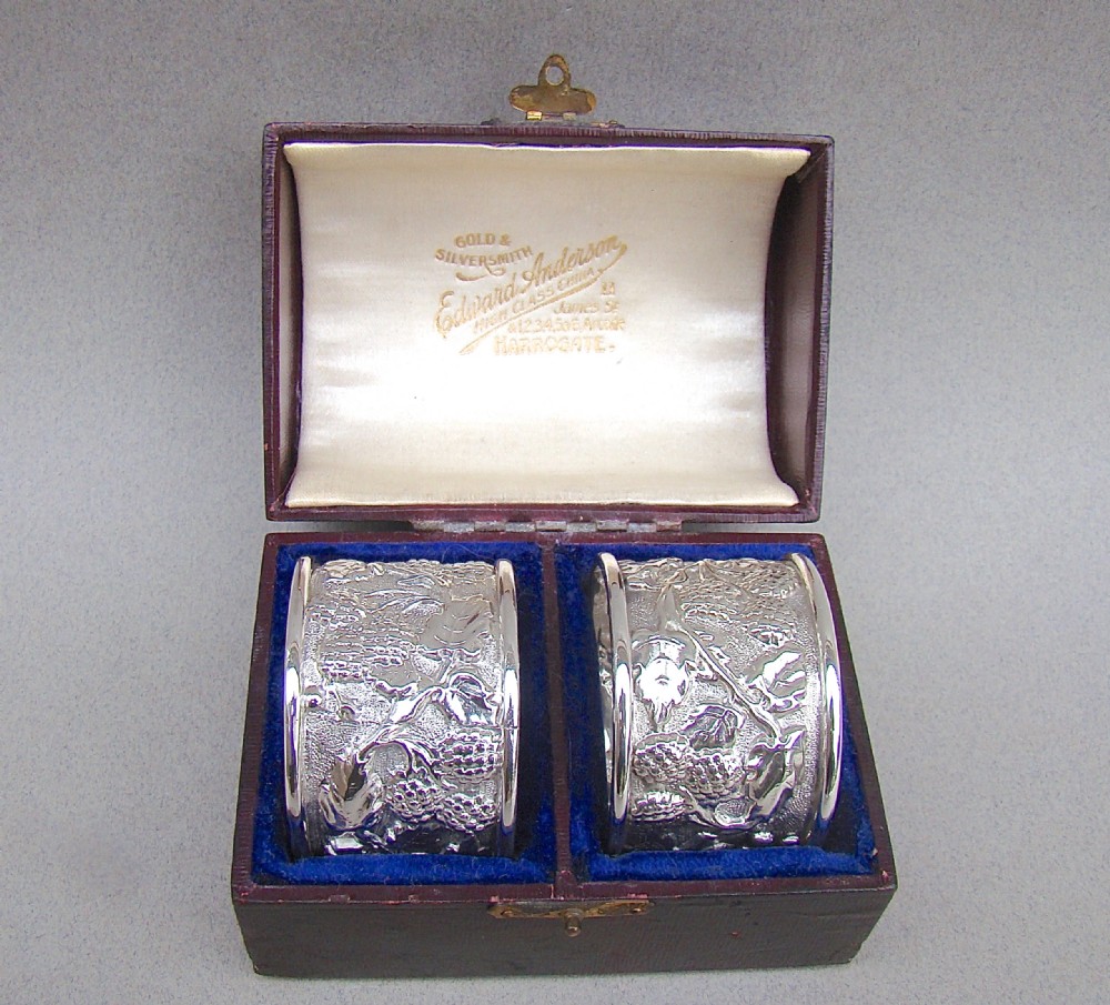 cased pair of arts craft silver napkin rings by thomas thomason co birmingham 1910
