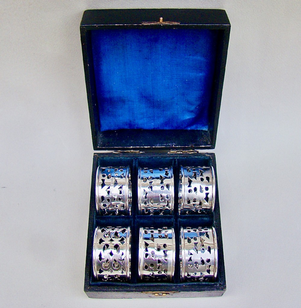 matched cased set of six edwardian solid silver napkin rings by broadway co birmingham circa 1910