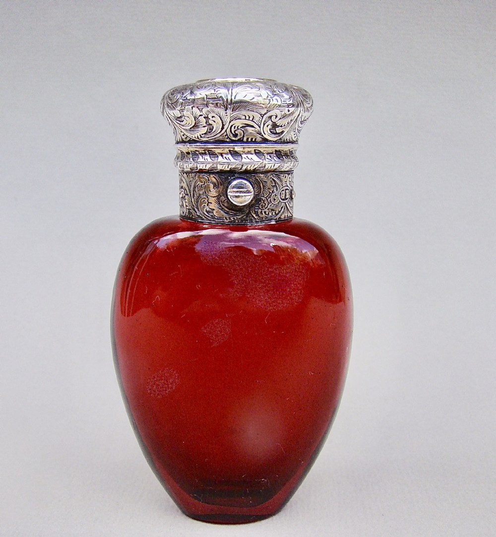 fine victorian silver gilt ruby glass scent bottle by george brace london circa 1860