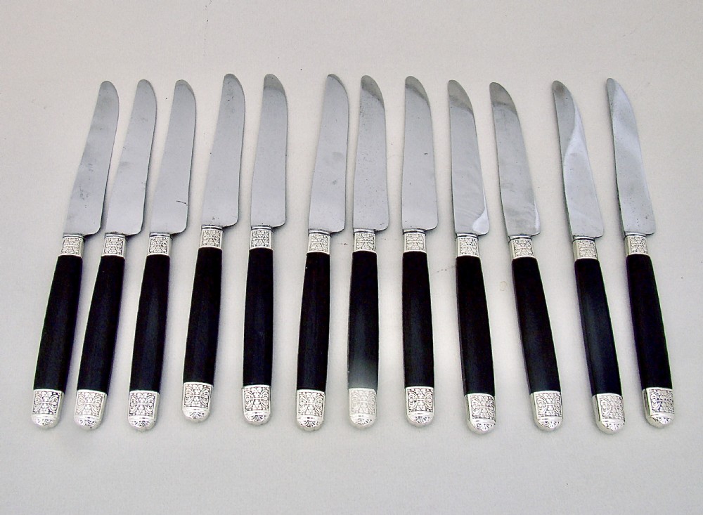 fabulous cased set of twelve silver plated french small knives with ebony handles and steel blades paris circa 1890