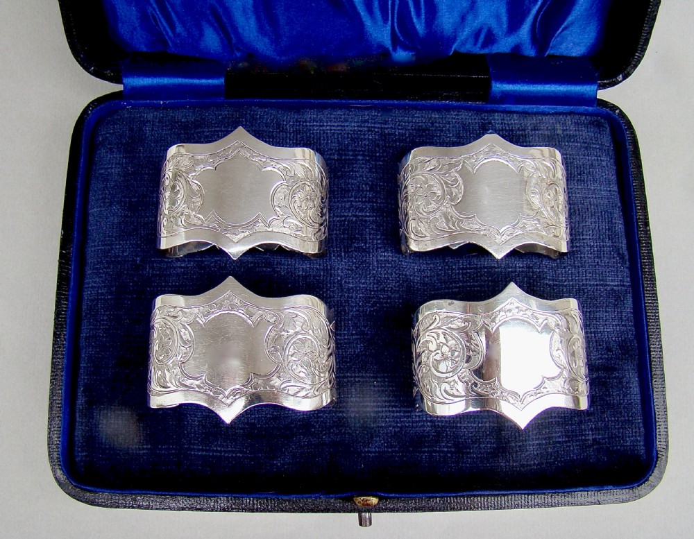 cased set of four edwardian solid silver napkin rings by robert chandler birmingham 1904