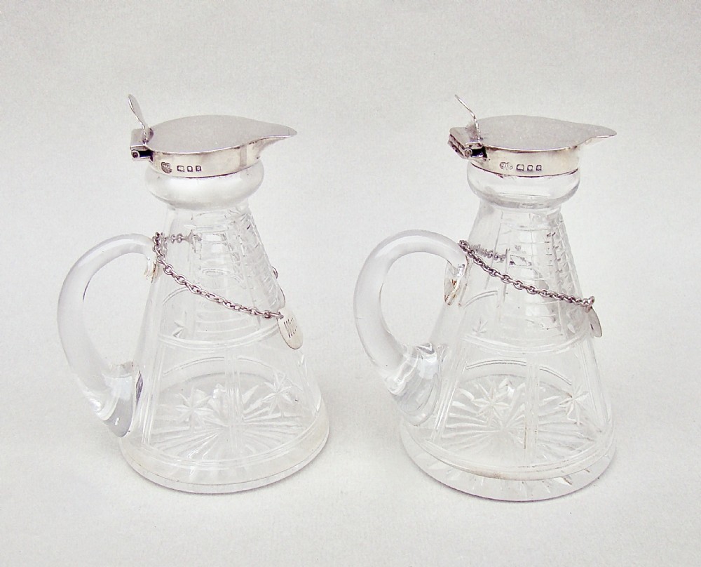 pair of art deco silver mounted whisky tots by the goldsmiths silversmith co ltd london 1933