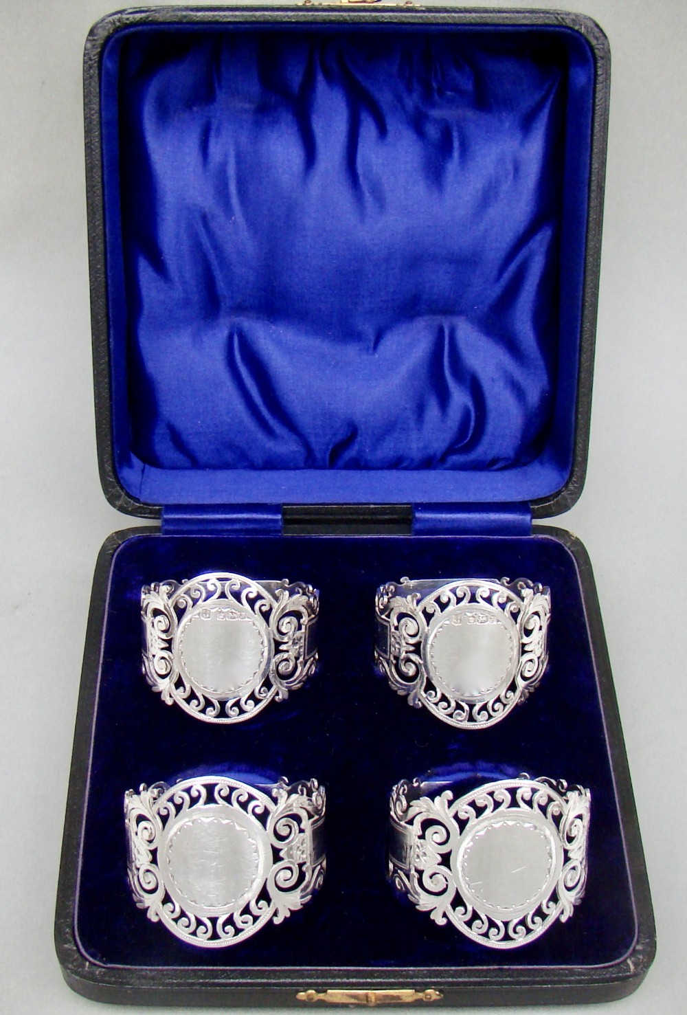 cased set of four edwardian solid silver napkin rings by cooper brothers sheffield 1907