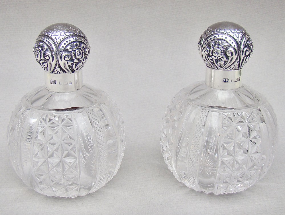 pair of edwardian silver cut glass scent bottles by george unite birmingham 1904