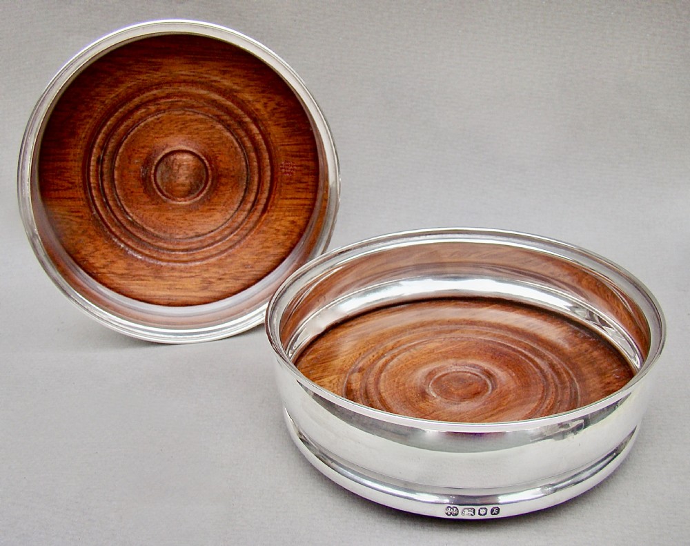 pair of midcentury solid silver wine coasters by j parkes co london 1965