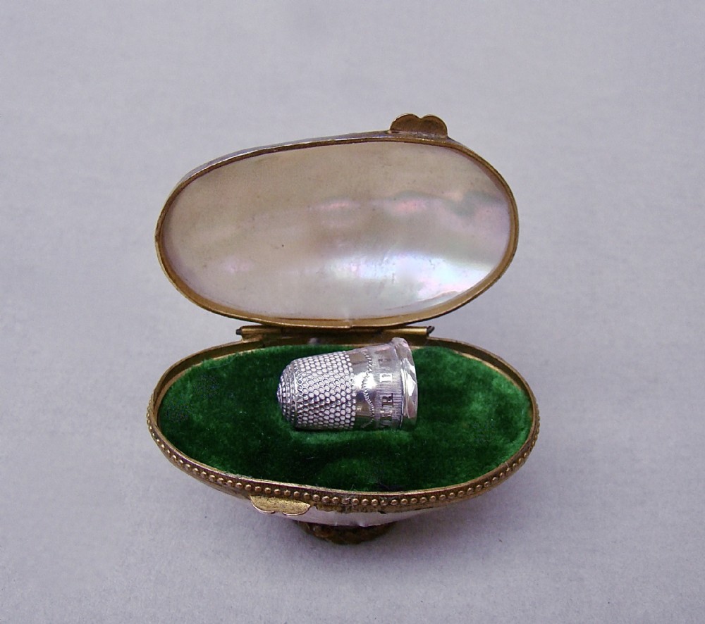 rare 19th c miniature silver thimble for a child in mother of pearl eggshaped case