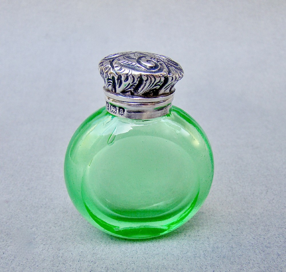 unusual victorian silver mounted uranium glass scent bottle by charles may birmingham 1900