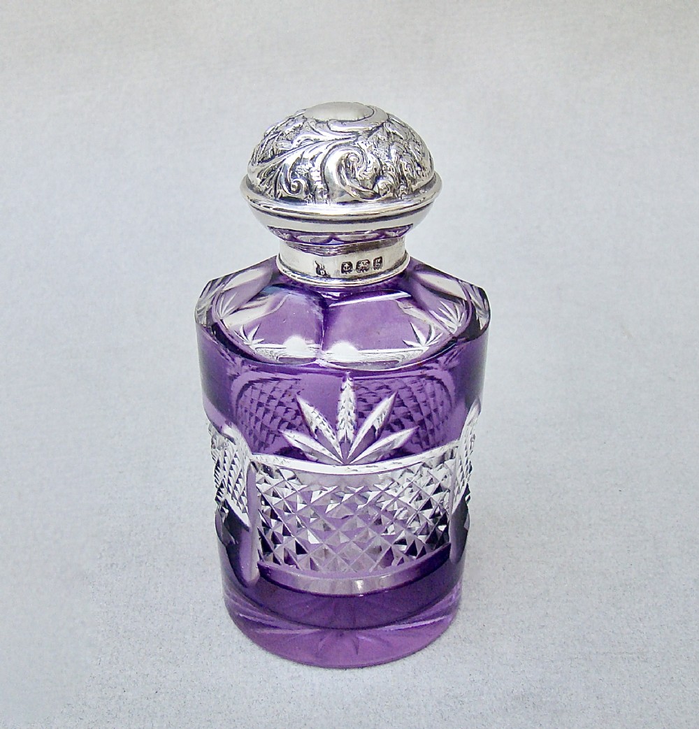 edwardian silver and bohemian overlay amethyst glass scent bottle by the boots company birmingham 1905